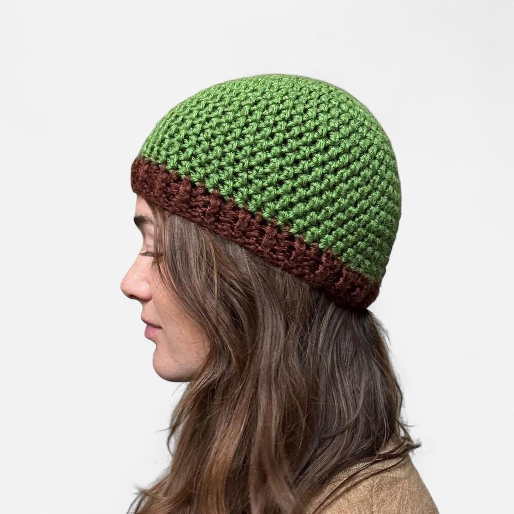 Green crochet beanie with brown trim